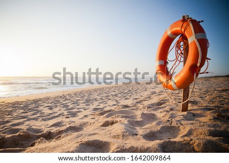 Orange buoy on a beach