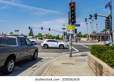 Orange, CA, USA – August 16, 2021: Red Traffic Light At The Intersection Of Tustin Street And Chapman Ave In The City Of Orange, California. 