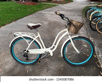 Orange, California / United States Of America - October 29 2019: A Blue And White Beach Cruiser Bike Parked On A Sidewalk On The Campus Of Chapman University.