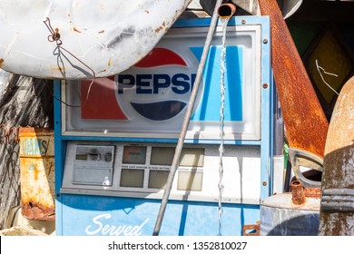 Orange, California/United States - 03/25/19: The Ruins Of An Old Pepsi Vending Machine Among Random Clutter