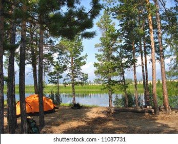 Orange Camp Tent Near The Lake