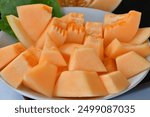 Orange cantaloupe melon fruit sliced  NF Gold Golden Egg, golden melon with orange flesh inside Specially selected imported Japanese melons Cut into pieces and ready to eat