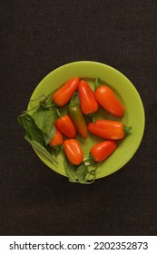 Orange Capsicum On A Green Plate