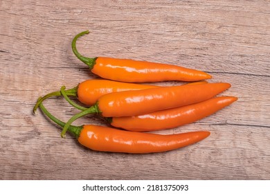 Orange Capsicum On Wooden Background