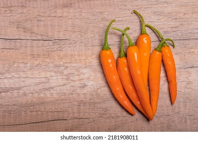 Orange Capsicum On Wooden Background