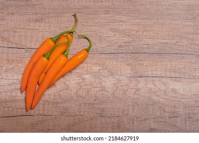 Orange Capsicum On Wooden Background