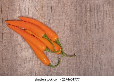 Orange Capsicum On Wooden Background