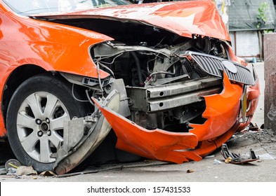 Orange Car Crash The Wall.