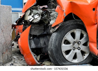 Orange Car Crash The Wall.