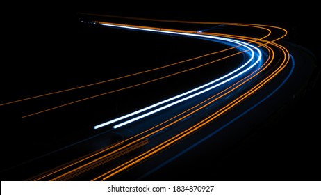 orange car lights at night. long exposure - Shutterstock ID 1834870927