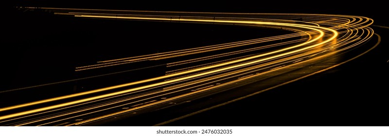 orange car lights at night. long exposure - Powered by Shutterstock