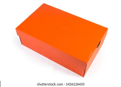 Orange Cardboard Shoes Box With Closed Lid On A White Background 
