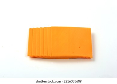 Orange Cheddar Cheese Slices Isolated On White