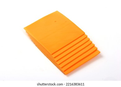 Orange Cheddar Cheese Slices Isolated On White