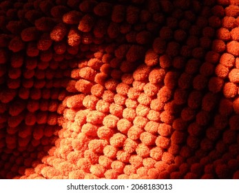Orange chenille texture with play of light and shadow in close up