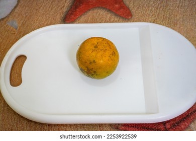orange citrus on a white cutting board - Shutterstock ID 2253922539