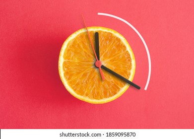 Orange With Clock Hands, Eight Hour Intermittent Fasting Diet Concept