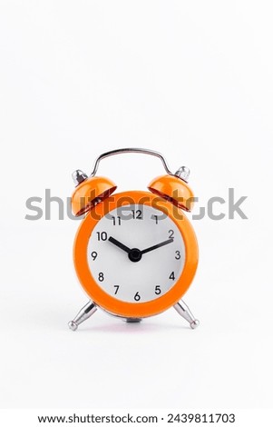 Orange The clock sets the time to 10.00. on white background isolate
