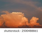 Orange cloud formations abstract nature background. Sky at sunset, orange cumulus clouds. Dramatic red and orange clouds.