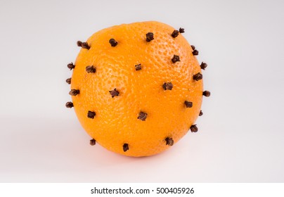 Orange With Clove Isolated On White