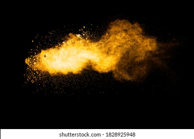 Orange Color Powder Explosion On Black Background.