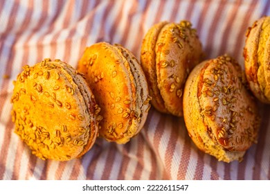 Orange Color Pumpkin Macaron Cookies Textured With Sesame Seeds