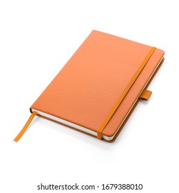 Orange colour leather fabric hardcover notebook with elastic band lay back on white surface. Top view with notebook closed. Isolated on white background. For mockup, branding & advertising. No People - Powered by Shutterstock