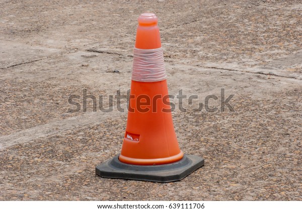 Orange cone, traffic signal\
warning