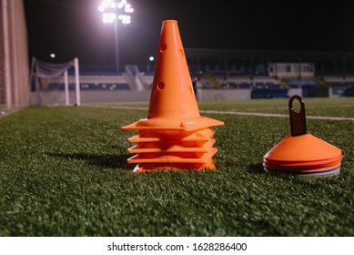 Orange Cones For Training Football On The Field At Night