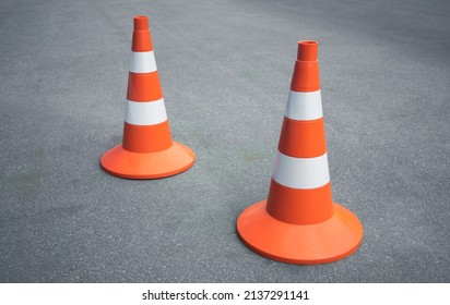 Orange Construction Cones On An Asphalt Road. Freeway Construction. Passing The Driver's License Exam.