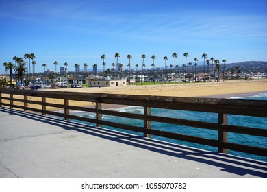 Orange County California Skyline And Beach From Pier                              