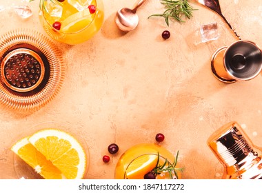 Orange Cranberry Vodka Rosemary Cocktail With Copper Bar Tools, Top View