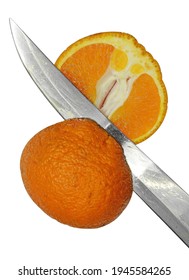 Orange cut with a knife into two parts isolated on a white background.