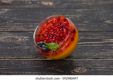 Orange Dessert Sambuk On Wooden Background.