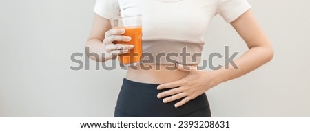 Orange detox juice, good digestive, young woman hand on stomach, belly with glass of vegetable juice, carrot smoothie for diet, girl drinking healthy meal food for weight loss isolated on background.