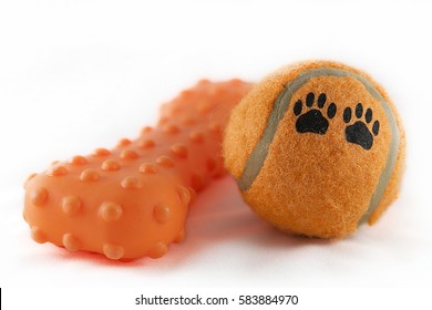 Orange Dog Toys Isolated On A White Background.