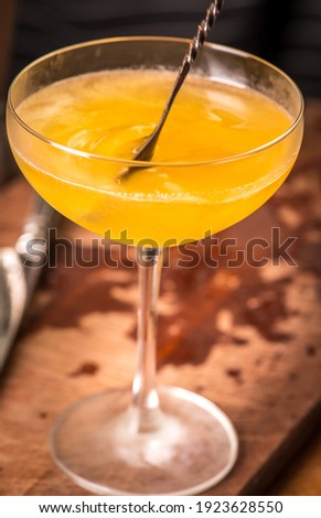 orange drink on bar table scene