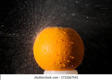 Orange With Drop Of Wather With Black Background