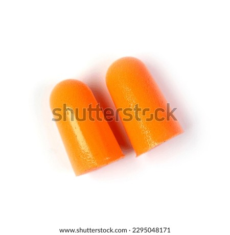 Orange earplugs isolated on white, top view
