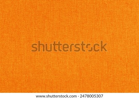 Orange fabric cloth texture for background, natural textile pattern.