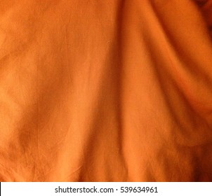 Orange Fabric Folds Background