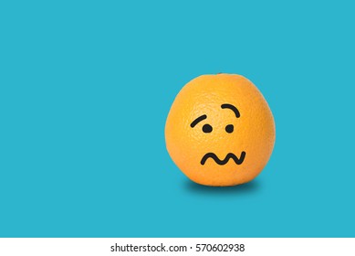 Orange Face Sad On Blue Background