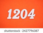 Orange felt is the background. The numbers 1204 are made from white painted wood.