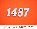 Orange felt is the background. The numbers 1487 are made from white painted wood.