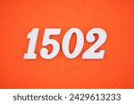 Orange felt is the background. The numbers 1502 are made from white painted wood.