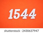 Orange felt is the background. The numbers 1544 are made from white painted wood.