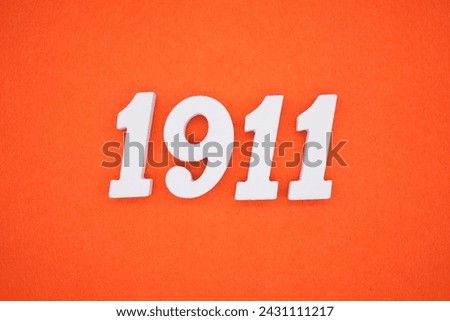 Orange felt is the background. The numbers 1911 are made from white painted wood.