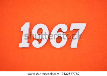 Orange felt is the background. The numbers 1967 are made from white painted wood.