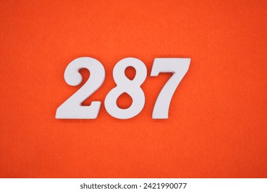 Orange felt is the background. The numbers 287 are made from white painted wood.