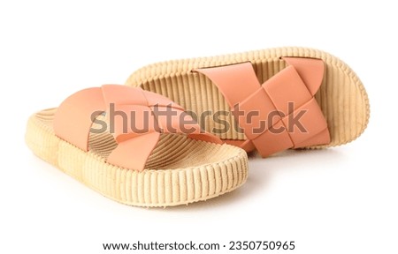 Orange female flip flops on white background